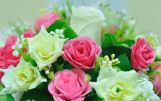 Beautiful flowers in basket on table.